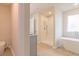 Elegant bathroom with soaking tub, shower, and modern fixtures at 1621 Fuma Leaf Way, Mcdonough, GA 30253