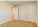 Bedroom with carpet, two doors and neutral wall color at 1621 Fuma Leaf Way, Mcdonough, GA 30253
