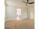 Bedroom with carpet flooring and access to bathroom at 1621 Fuma Leaf Way, Mcdonough, GA 30253