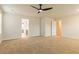 Bright bedroom with ceiling fan and access to bathroom and closet at 1621 Fuma Leaf Way, Mcdonough, GA 30253