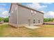 Gray house exterior with a backyard and stone accents at 1621 Fuma Leaf Way, Mcdonough, GA 30253