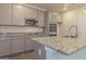 Modern kitchen with gray cabinets and granite countertops at 1621 Fuma Leaf Way, Mcdonough, GA 30253