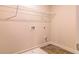 Laundry room with built-in shelving and vinyl flooring at 1621 Fuma Leaf Way, Mcdonough, GA 30253