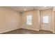 Bright living room with wood-look flooring and a door leading outside at 1621 Fuma Leaf Way, Mcdonough, GA 30253