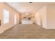 Spacious living room with vinyl plank flooring and modern lighting at 1621 Fuma Leaf Way, Mcdonough, GA 30253