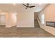 Open living room featuring a ceiling fan and fireplace at 1621 Fuma Leaf Way, Mcdonough, GA 30253