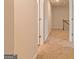 Upstairs hallway with carpet and doors to bedrooms at 1621 Fuma Leaf Way, Mcdonough, GA 30253