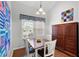 Bright dining area with wood floors, a table for four, and built-in cabinetry at 3710 Abbott Ct # 9, Powder Springs, GA 30127