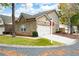 Brick townhouse with two-car garage and landscaped lawn at 3710 Abbott Ct # 9, Powder Springs, GA 30127