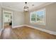 Bright dining room with hardwood floors and large window at 785 Alice St, Forest Park, GA 30297