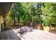 Spacious deck with wooded backyard view and wooden railings at 8325 Attleboro Dr, Jonesboro, GA 30238