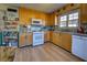 Galley kitchen with wood cabinets and granite countertops at 3332 Salem Cove Trl, Conyers, GA 30013