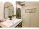 Modern bathroom with hexagon tile floor and walk-in shower at 929 Creekdale Dr, Clarkston, GA 30021