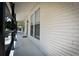 Side porch with white brick exterior and black accents at 929 Creekdale Dr, Clarkston, GA 30021