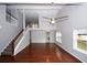 High ceiling living room with hardwood floors and staircase at 560 Woodstone Rd, Lithonia, GA 30058