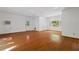 Spacious living room featuring hardwood floors and abundant natural light at 1112 Warrenhall Ne Ln, Brookhaven, GA 30319