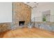 Elegant living room with hardwood floors and a stone fireplace at 1112 Warrenhall Ne Ln, Brookhaven, GA 30319