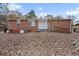 Brick home with backyard and wooden deck at 2707 Crescendo Nw Dr, Atlanta, GA 30318