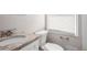 Updated bathroom with granite vanity and white fixtures at 2707 Crescendo Nw Dr, Atlanta, GA 30318