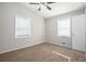 Bedroom with carpet, ceiling fan and two windows with blinds at 2707 Crescendo Nw Dr, Atlanta, GA 30318