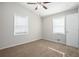 Spacious bedroom with neutral carpeting and ceiling fan at 2707 Crescendo Nw Dr, Atlanta, GA 30318