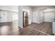 Open living room and kitchen area with vinyl flooring at 2707 Crescendo Nw Dr, Atlanta, GA 30318