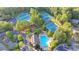 Aerial view of community amenities including tennis courts and swimming pool at 5530 Highland Preserve Dr, Mableton, GA 30126