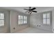 Bright bedroom with ceiling fan and plantation shutters at 5530 Highland Preserve Dr, Mableton, GA 30126