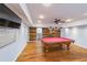 Basement game room with pool table, wood accent wall, and recessed lighting at 2034 Haydenbrook Nw Dr, Acworth, GA 30101