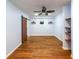 Basement space with bamboo flooring, a barn door, and built-in shelving at 2034 Haydenbrook Nw Dr, Acworth, GA 30101