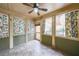 Bright sunroom with tiled floor and tropical-themed curtains, perfect for relaxation at 2034 Haydenbrook Nw Dr, Acworth, GA 30101