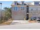 Front exterior view of a two-story home with a garage at 3080 Cedar Glade Ln, Buford, GA 30519