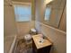 Updated bathroom with vanity and window at 1877 Lomita Rd, Atlanta, GA 30316