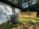 Backyard with a wooden deck, AC unit, and grassy area at 3426 Treadwell Sw Cir, Atlanta, GA 30331