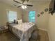 Inviting bedroom with a ceiling fan, plush bedding, and ample natural light at 3426 Treadwell Sw Cir, Atlanta, GA 30331