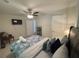 Relaxing bedroom featuring a ceiling fan, plush bedding, and a TV at 3426 Treadwell Sw Cir, Atlanta, GA 30331