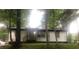 White brick ranch home nestled among lush green trees at 3426 Treadwell Sw Cir, Atlanta, GA 30331