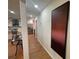 Hallway leading to the kitchen with modern artwork at 3426 Treadwell Sw Cir, Atlanta, GA 30331