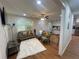 Living room with open concept to kitchen, featuring hardwood floors and comfy seating at 3426 Treadwell Sw Cir, Atlanta, GA 30331