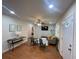 Open living area with hardwood floors, comfy seating, and a large TV at 3426 Treadwell Sw Cir, Atlanta, GA 30331