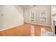 Spacious living room with hardwood floors, fireplace, and large windows at 9889 Vista Cir, Union City, GA 30291