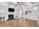 Spacious living area with hardwood floors, fireplace, and a stunning staircase at 5435 Cole Creek Ln, Cumming, GA 30040