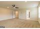 Spacious bedroom with ceiling fan and access to bathroom at 1620 Fuma Leaf Way, Mcdonough, GA 30253