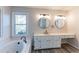 Updated bathroom with double vanity, soaking tub, and walk-in shower at 1237 Wynford Woods Sw, Marietta, GA 30064