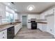 White kitchen with granite counters & stainless steel appliances at 1237 Wynford Woods Sw, Marietta, GA 30064