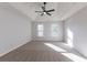 Spacious main bedroom with carpeted floors and ceiling fan at 1237 Wynford Woods Sw, Marietta, GA 30064