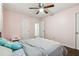 Simple bedroom with light pink walls and access to hallway at 2612 Wicklow Way, Powder Springs, GA 30127