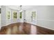 Bright dining room with hardwood floors and large windows at 2612 Wicklow Way, Powder Springs, GA 30127