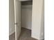 Walk-in closet featuring wire shelving and neutral-colored carpet flooring at 3810 Equity Ln, Powder Springs, GA 30127