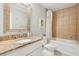 Bathroom with granite vanity, white cabinets, and a bathtub at 910 E Lake Dr, Decatur, GA 30030